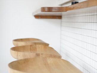 three brown wooden stools beside brown wooden desk